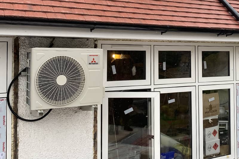 External air conditioner installed during a house renovation.