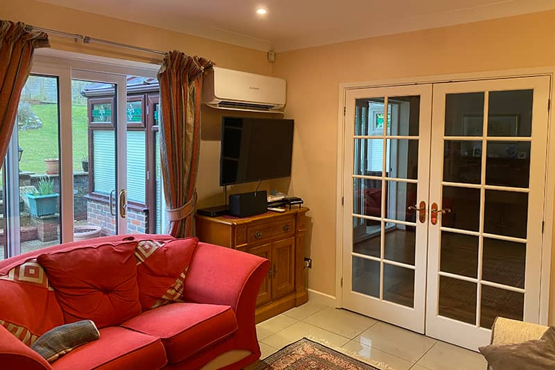 Wall mounted air conditioner installed in a living room.