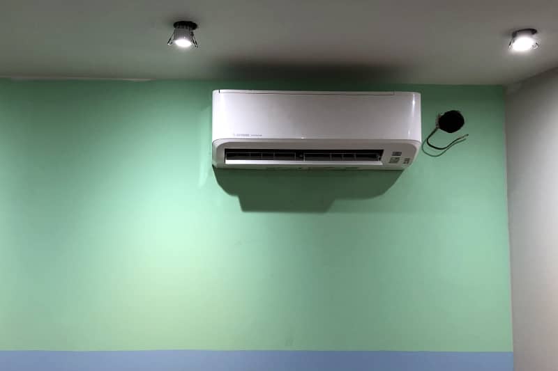 Wall mounted air conditioner installed at a patient transport office.