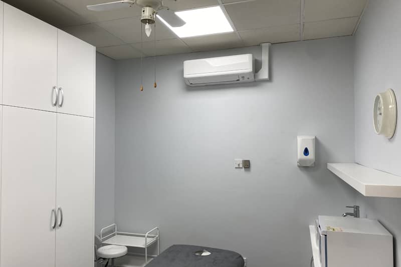 Wall mounted air conditioner installed in a therapy room.