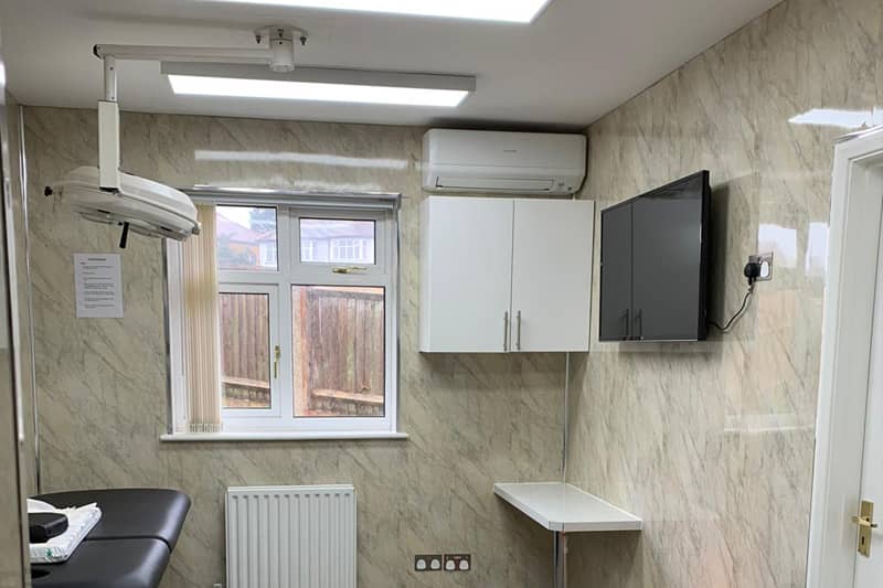 Wall mounted air conditioner installed in a consulting room.