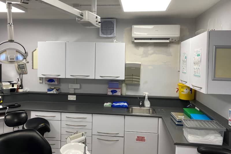 Wall mounted air conditioner installed in a dental practice.
