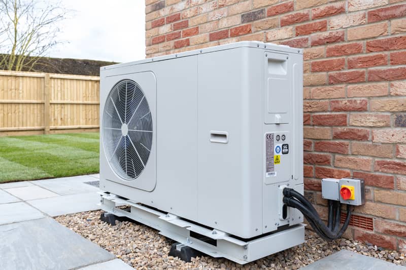 Air source heat pump fitted outside a new home development