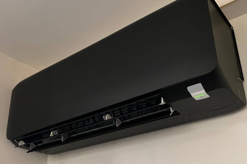 Black wall mounted Mitsubishi air conditioner installed.