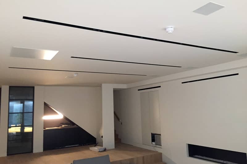 Celiling air conditioning vents in a living room.