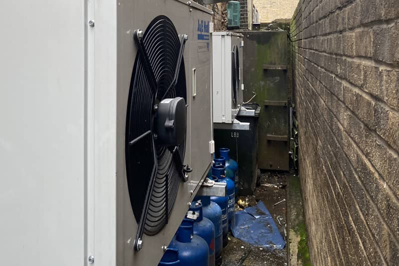Two external air conditioning units at a commercial premis.