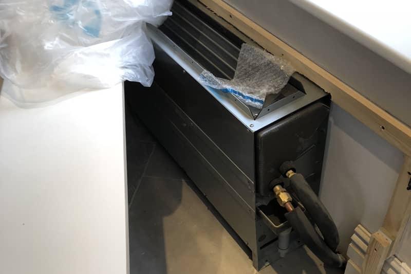 Air conditioner concealed behind a customised window unit.