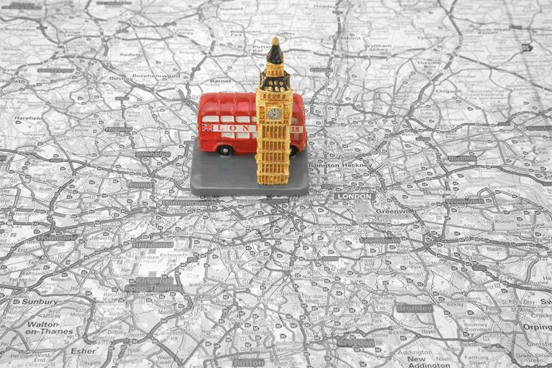 Map of London with a model of Elizabeth Tower and a London routemaster bus.