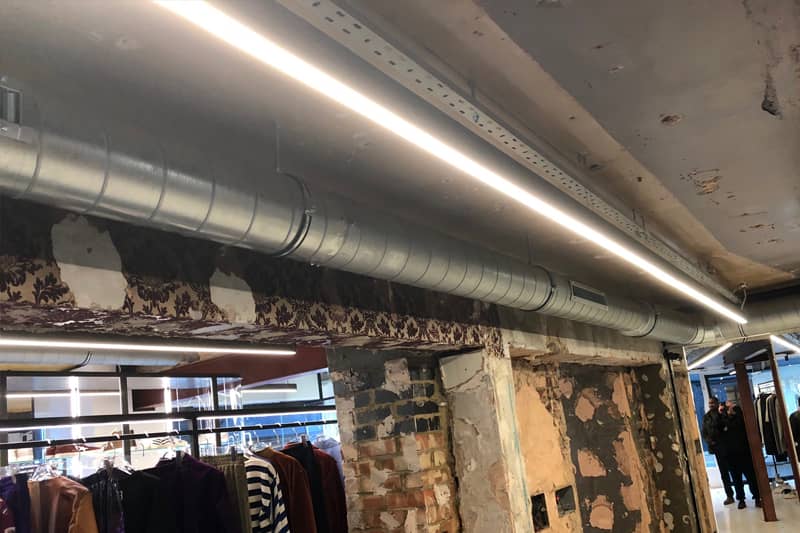 Ducted air conditioning installation during a fashion shop fitout.