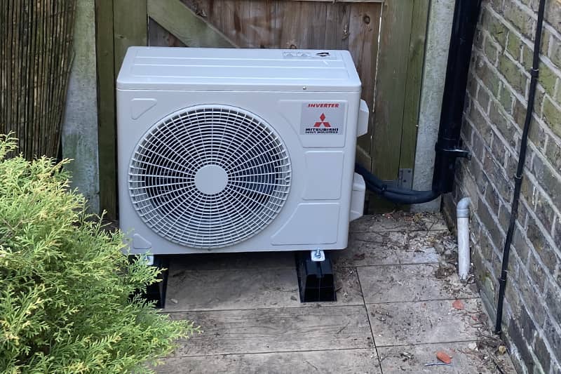 External Mitsubishi air conditioning inverter installed outside a property.