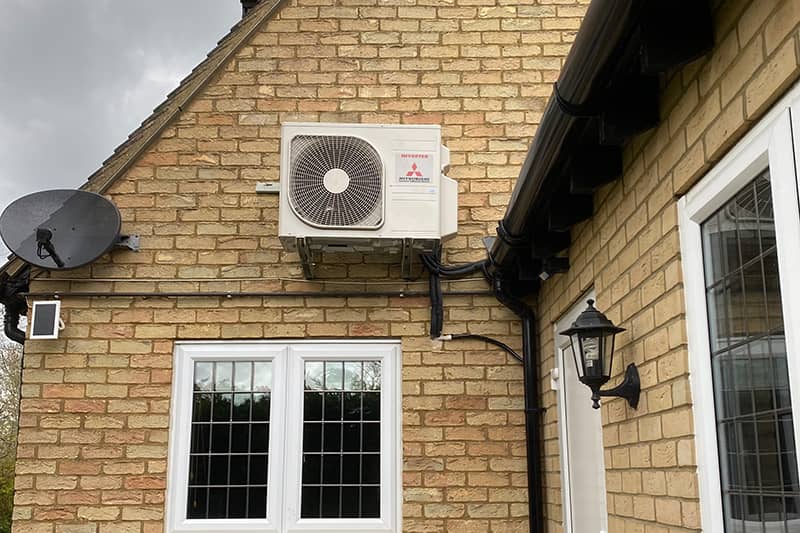 External Mitsubishi inverter installed to the rear of the property.