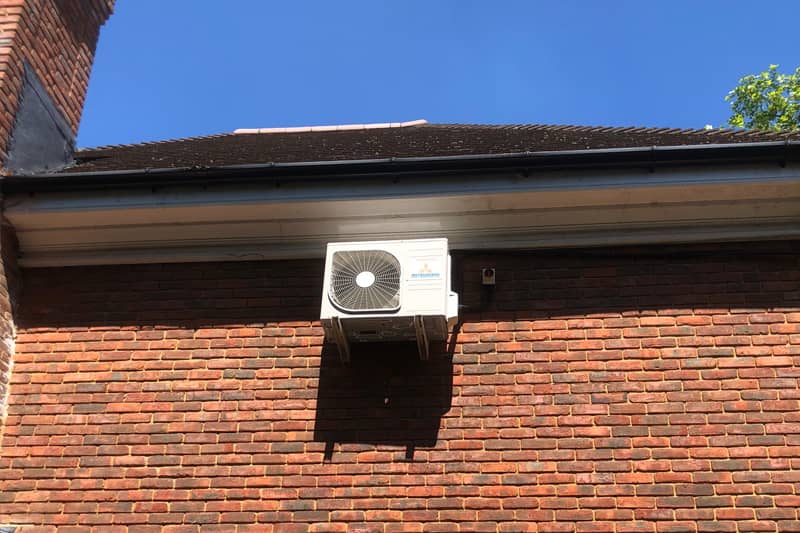External Mitsubishi air conditioner installed at a house.