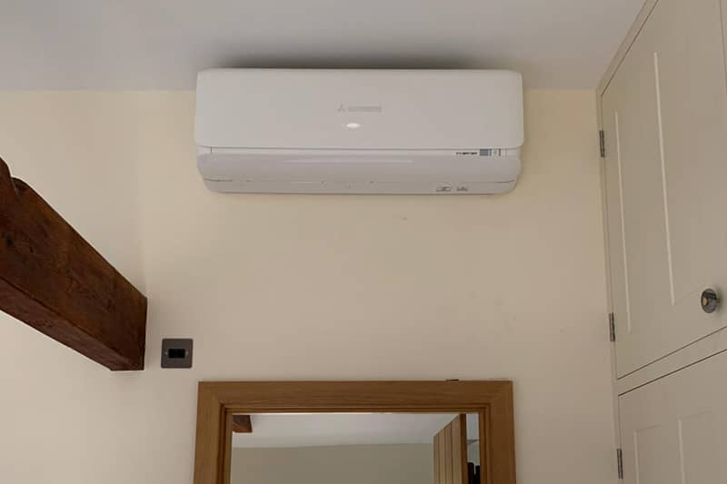 Wall mounted Mitsubishi air conditioner installed in a home.