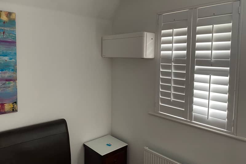Freshly installed wall mounted air conditioning unit in a home.