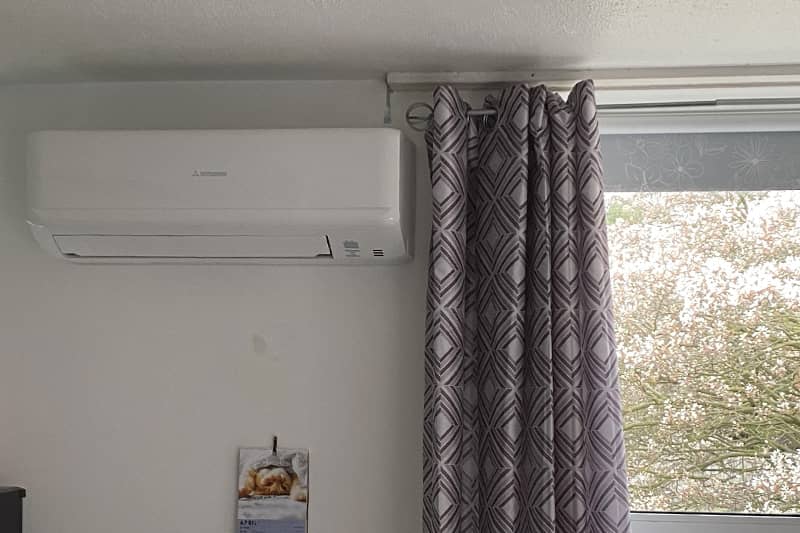 New air conditioning wall mounted in a home kitchen.