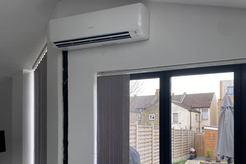Wall mounted Mitsubishi air conditioner installed in a home.