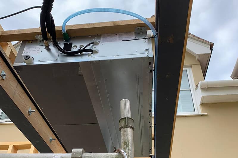Air conditioner installation during a property renovation.