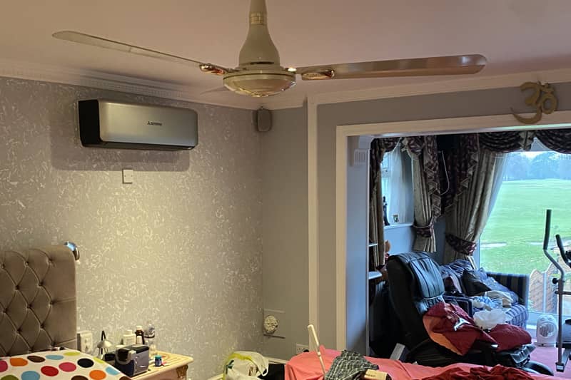 Air conditioner installed in a home bedroom.