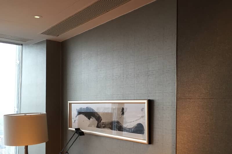 Ducted air conditioning inspection in a London hotel room