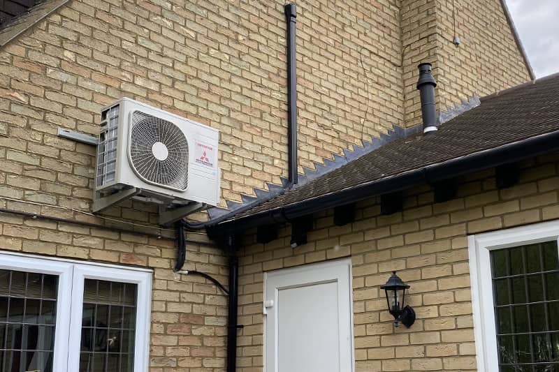 Wall mounted Mitsubishi air conditioning inverter installed at a home.