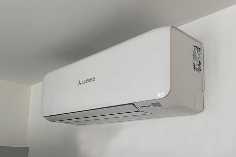 Wall mounted Mitsubishi air conditioner installed in a home.