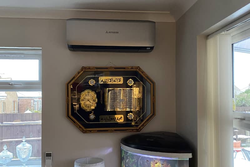 Mitsubishi air conditioner installed in a living room.