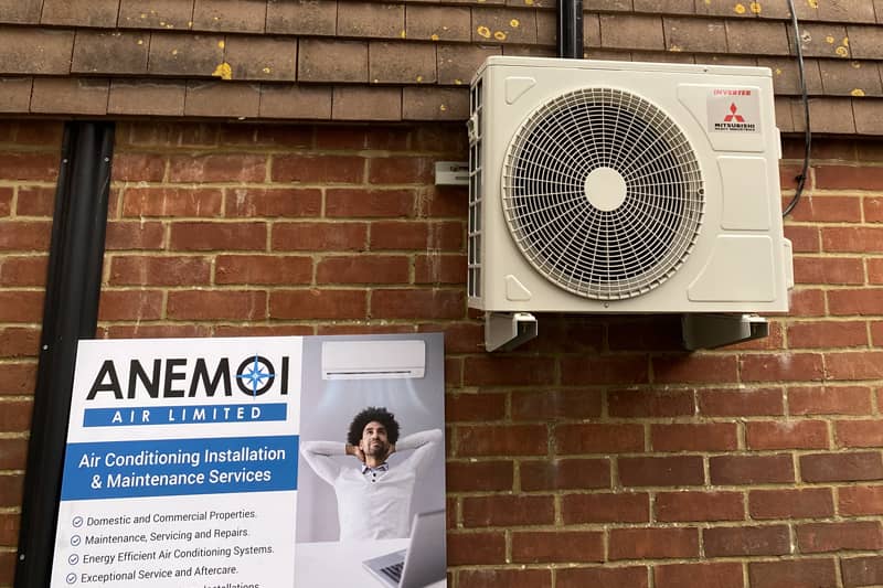 Freshly installed external air conditioning unit on the rear of the property.