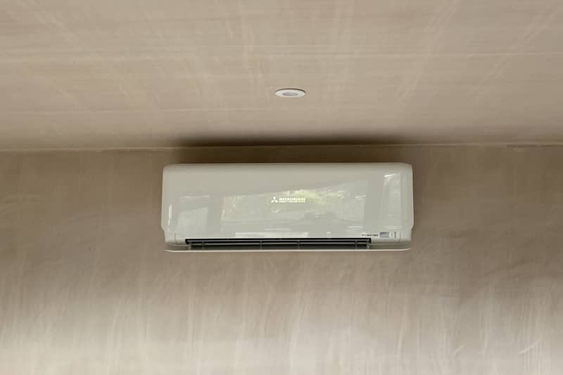 Mitsubishi wall mounted air conditioning installation during home renovation.